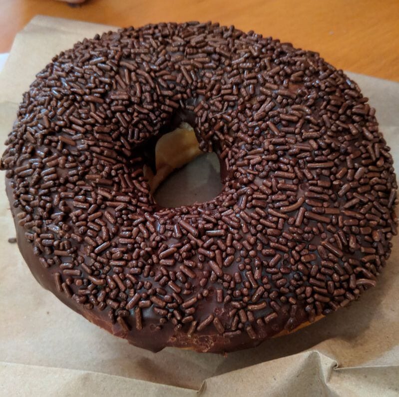 A chocolate donut with sprinkles as seen in Davis Square, Somerville. 