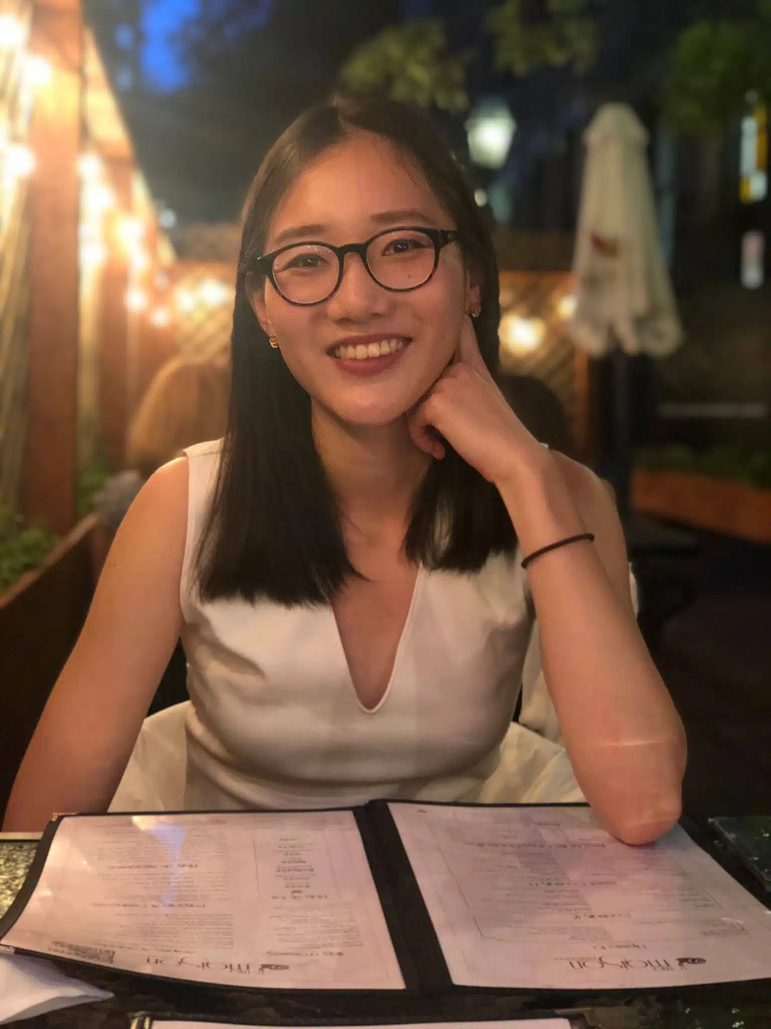 girl at table smiling